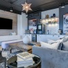 a clubhouse room with a tv, a couch and a coffee table