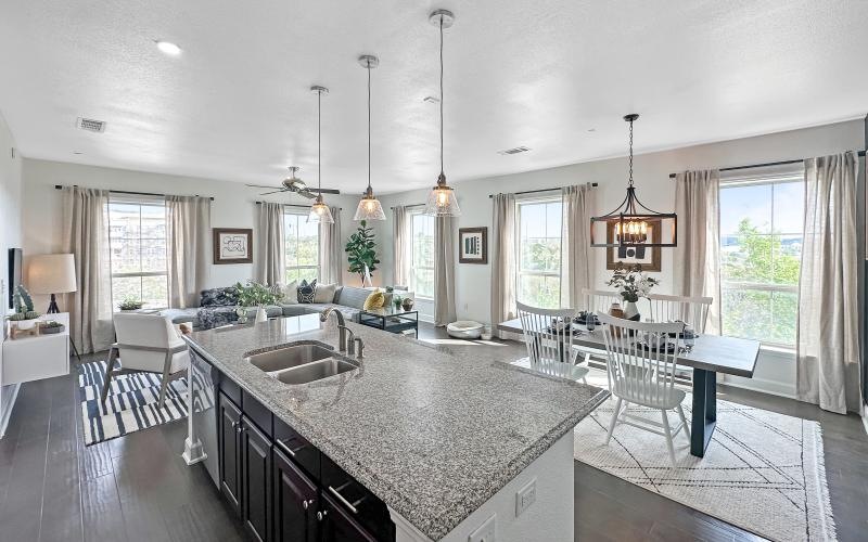 a kitchen with a marble island